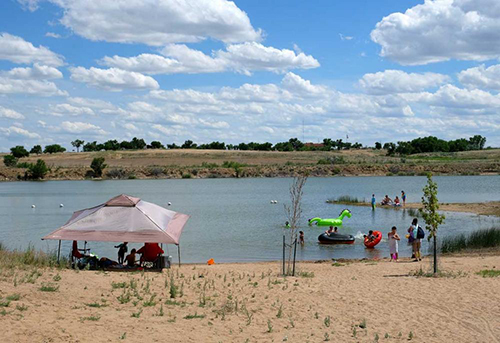 People play in the water and along the beach at John Martin Reservoir. Photo courtesy: Colorado.com 